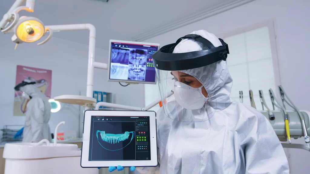dentist coverall showing-x-ray tablet stomatology used in dentistry