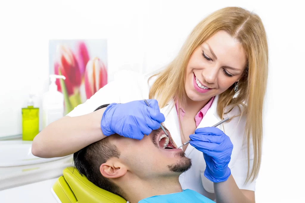 female dentist treating patient
